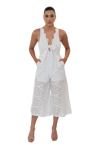 White eyelet jumpsuit with lattice detail, front tie, wide leg and open back.