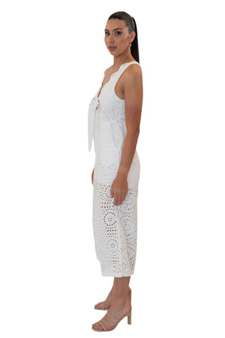 Side view of white eyelet jumpsuit with side pockets