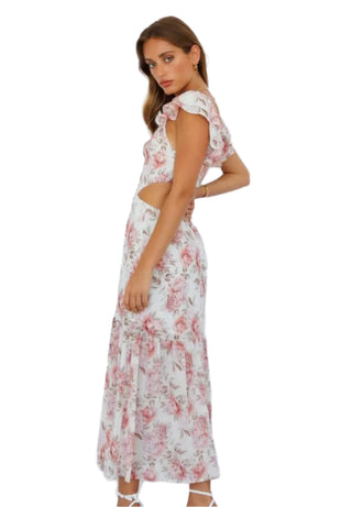 Side view of floral maxi dress with cut out and ruffle sleeves.