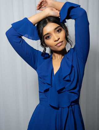 Close up view of the beautiful blue ruffle playsuit with long sleeves.