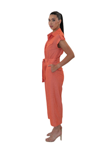 Side view of jumpsuit with side pockets and shoulder tabs.
