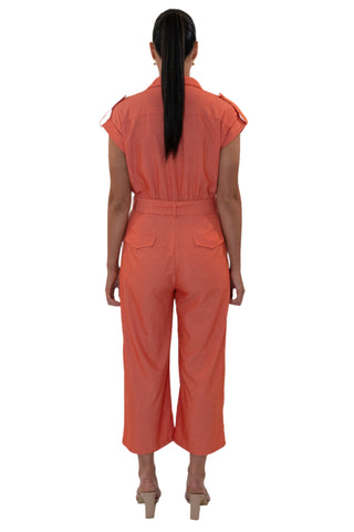 Back view of jumpsuit with back pockets and tie waist.