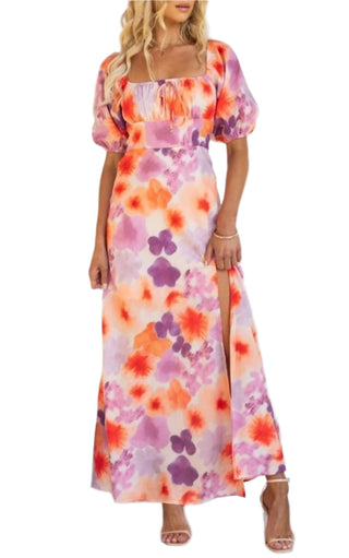 Printed maxi dress with puff sleeves and thigh high split.