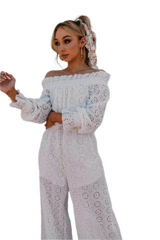 White off the shoulder, long sleeve, eyelet jumpsuit.
