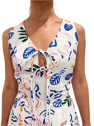 Close up of printed dress with two front lace up at bust, bra friendly mini dress.