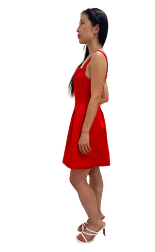 Side viewof the full skirt red mini dress.