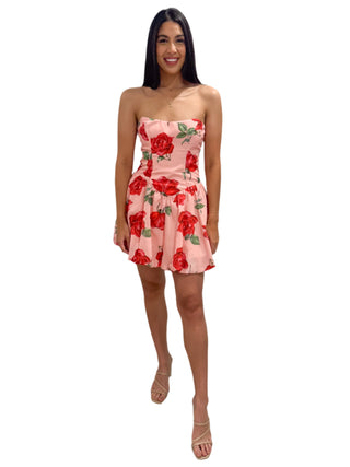 Beautiful model wearing strapless floral print mini dress with puff skirt