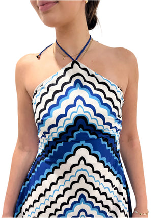 Close up of the halterneck dress with blue, black and white print.