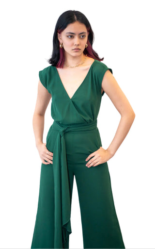 Close up view of the cross over v neckline jumpsuit with tie waist and side pockets.