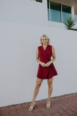 Alanna Smith wearing our Ruby Rose red cross over playsuit with side pockets