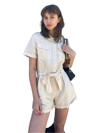 Cream linen playsuit with pockets and wait tie.