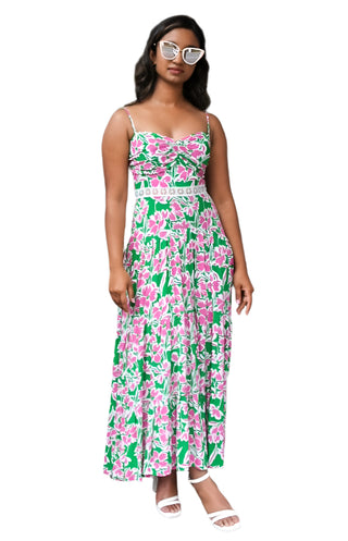 Model styled in pink, white and green flowy maxi dress with fitted ruched bust sunglasses and heels.