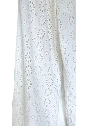 Close up view of eyelet fabric of jumpsuit.