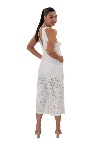 White eyelet jumpsuit with side pockets and open back.