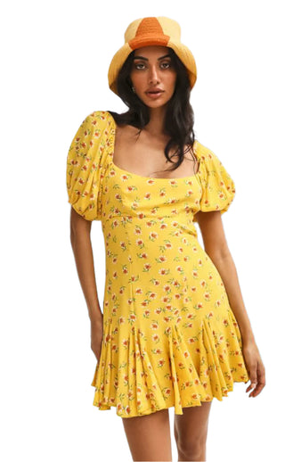 Printed mini dress styled with hat.