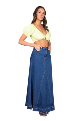 Side view of denim maxi skirt in deep blue.