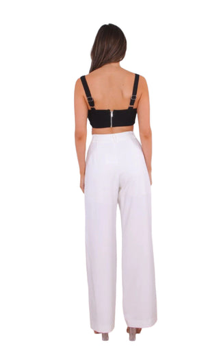 Back view of white high waisted pants with a wide leg.