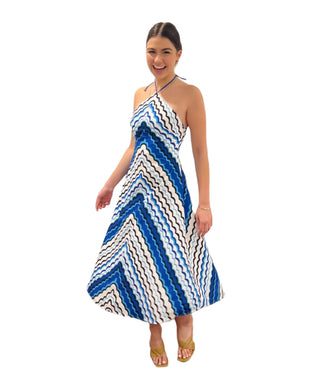 Halterneck midi dress with blue, white and black swirls.