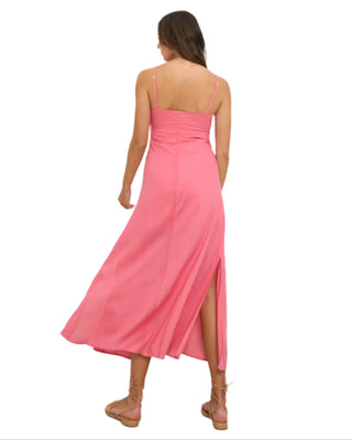 Back view of pink midi dress with side slit.