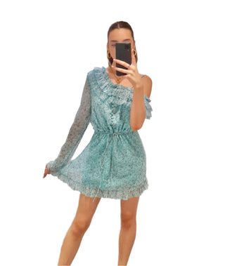 Close up of ruffles on the one arm mini dress.