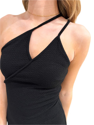 Close up of one shoulder black midi dress with double straps.