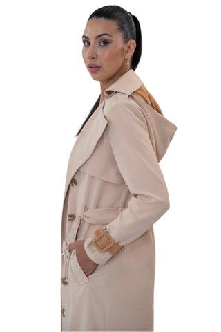 Side view of womens trench coat with detachable hood and reversible cuffs.
