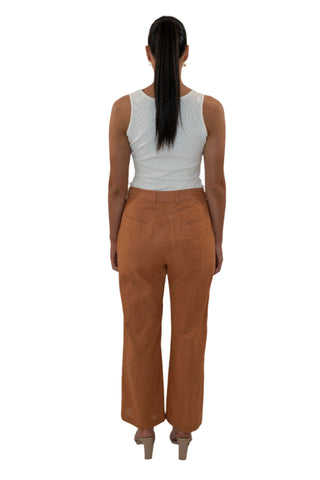 Back view of brown linen high waisted pants with pockets.