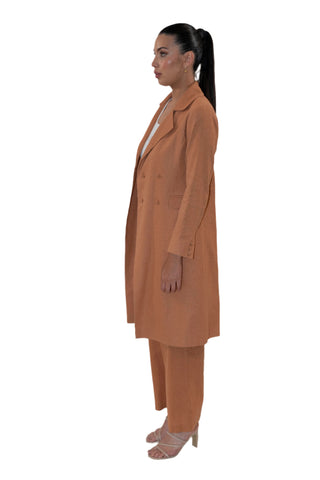 Side view of long line blazer with button detail.