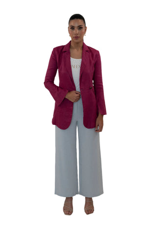Fuchsia linen blazer styled with white singlet and grey pants.