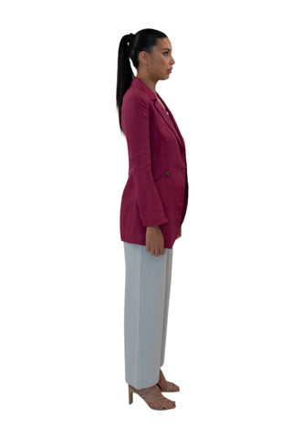 Side view of fuchsia double breasted blazer longer length.