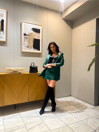 Amplified Beauty CEO Shahna Smith wearing our forest green vegan leather Andrea Blazer & matching Ari Skirt