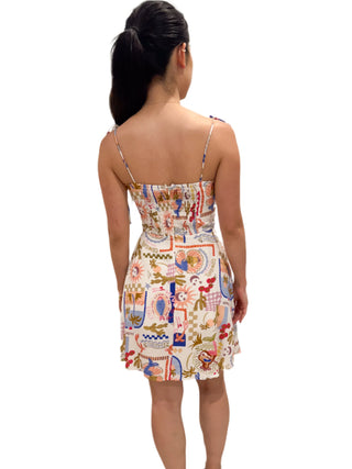 Back view of the postcard print mini dress with zip up back and ruched stretch pannel for comfort and perfect fit.