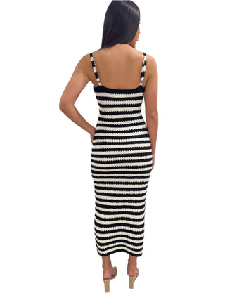 Back view of woven knit maxi dress with adjustable straps
