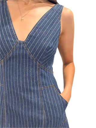 Close up of the pinstripe fabric of mini denim dress