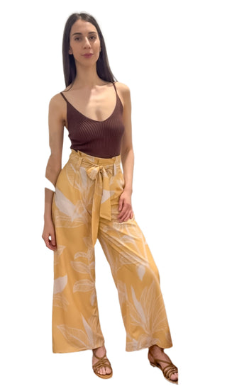 Brown ribbed knit singlet top styled tucked into high waisted wide leg printed pants with wait tie.