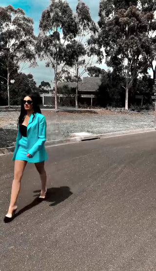 Amplified Beauty CEO Shahna Smith wearing our blue linen Southampton Blazer & Sardegna Skirt matching set