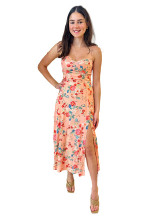Floral print mini dress with tie shoulders and front split.