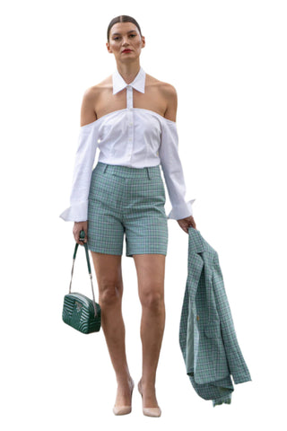 Checked high waisted shorts with cut out white shirt and matching blazer.