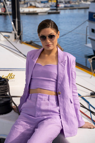 Close up view of the beautiful lilac colour of the three piece matching blazer, crop and pant set.