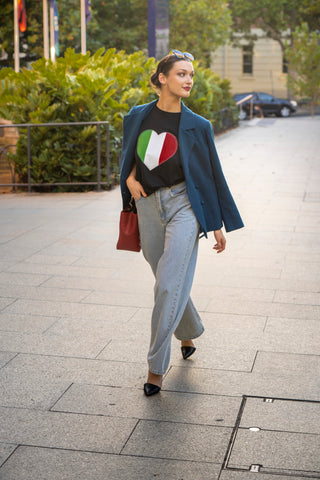 Street styled linen blazer with logo tee and wide leg jeans.