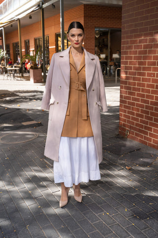 Cream wool coat elevated with layers and pointed heel