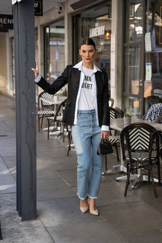 Edgy linen black blazer styled with white logo tee and jeans.