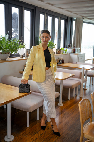 Workwear linen blazer worn over pinstripe midi skirt