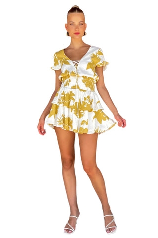 White and yellow mini dress with lace up front and elasticated waist styled with white heel.