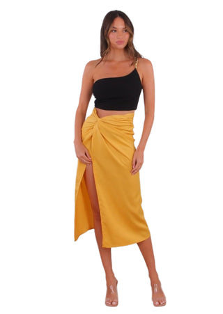 Golden yellow coloured skirt with draping and thigh high split.