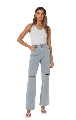 Silver lurex tank styled with denim and heel.