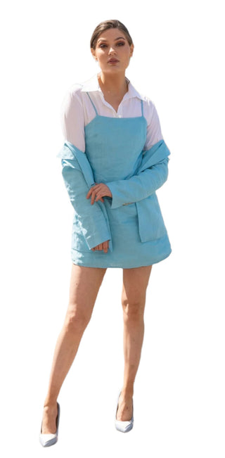 Blue singlet strap mini dress layered over a white shirt and matching blue blazer.