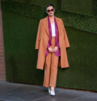 High fashion womens jacket with matching pant layered over a blazer and tee.