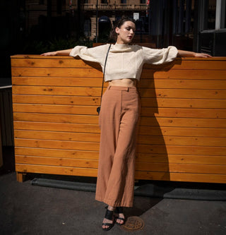High waisted pants street styled with crop knit jumper and black heel.