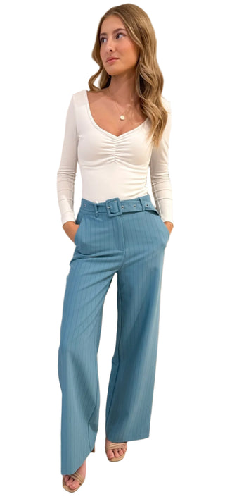 Long sleeve fitted white top with ruched bust v neckline.